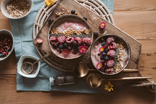 smoothie bowl topped with fruits and nuts