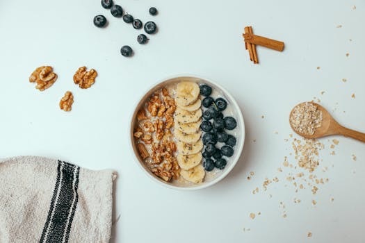 smoothie bowl topped with fruits and seeds