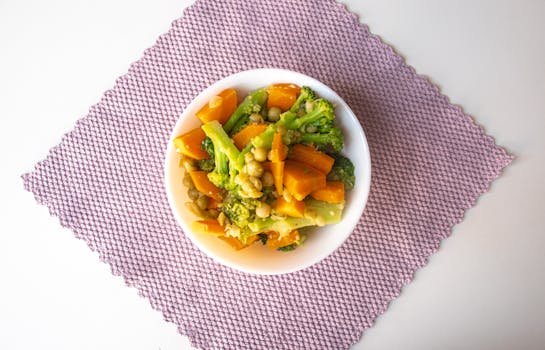 Meal prep containers filled with colorful vegetables