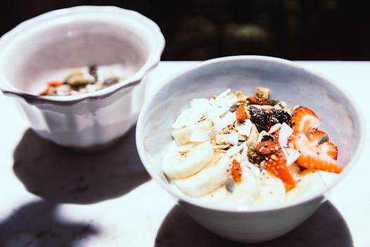 smoothie bowl topped with fruits and seeds