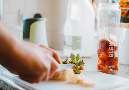 fruit-filled smoothie jars ready for blending