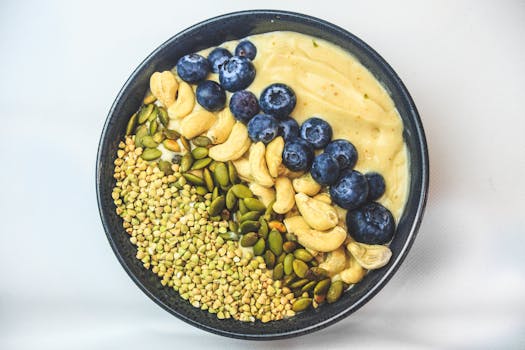 colorful smoothie bowl topped with berries