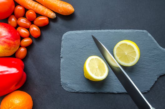 juicing process with colorful fruits and vegetables